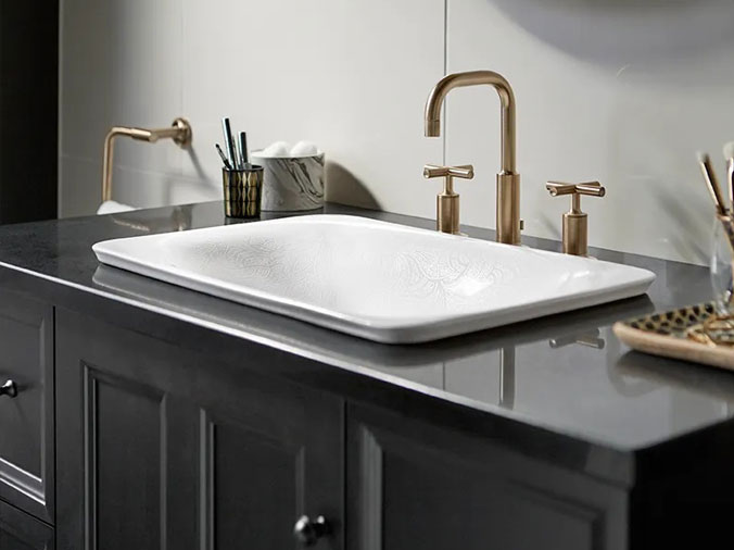 Bathroom sink with bronze faucet