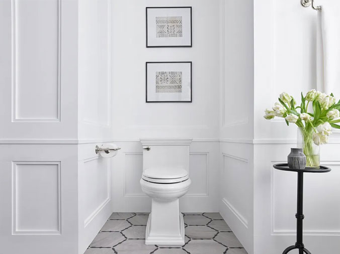 Toilet in white bathroom