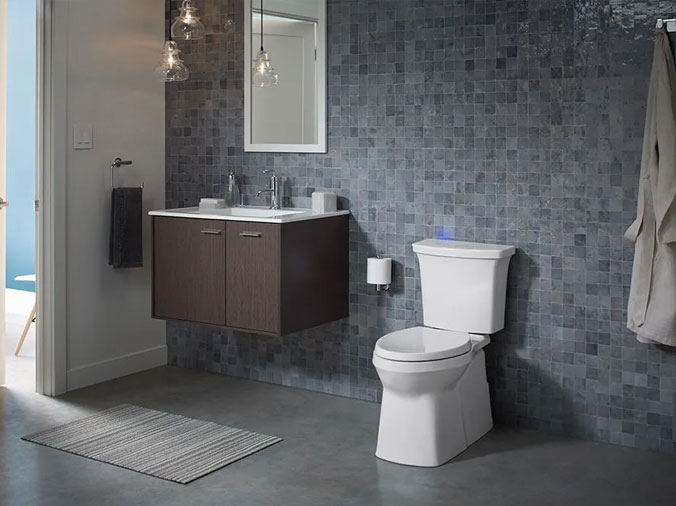 Bathroom with grey tile walls and floor