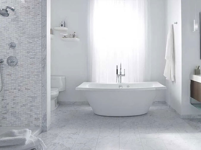 White bathrooom with free standing bathtub
