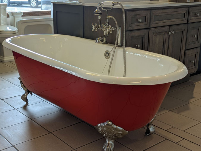 Red free standing bathtub in the State Supply Kitchen & Bath Showroom in Ipswich MA